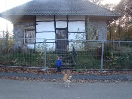 The Bouwberg cottage behind security fencing